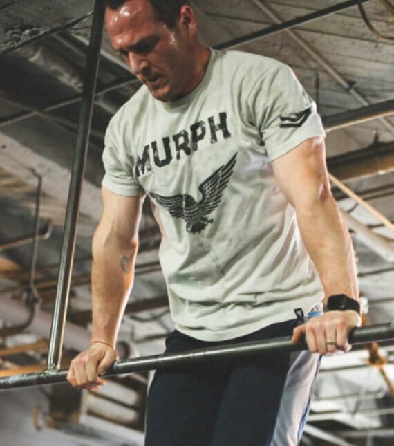 Man working out during CrossFit training session at Help First Fitness